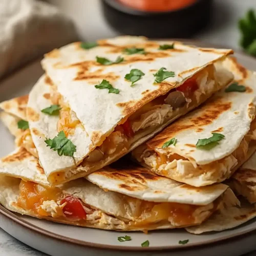 Mexican Crockpot Chicken Quesadillas
